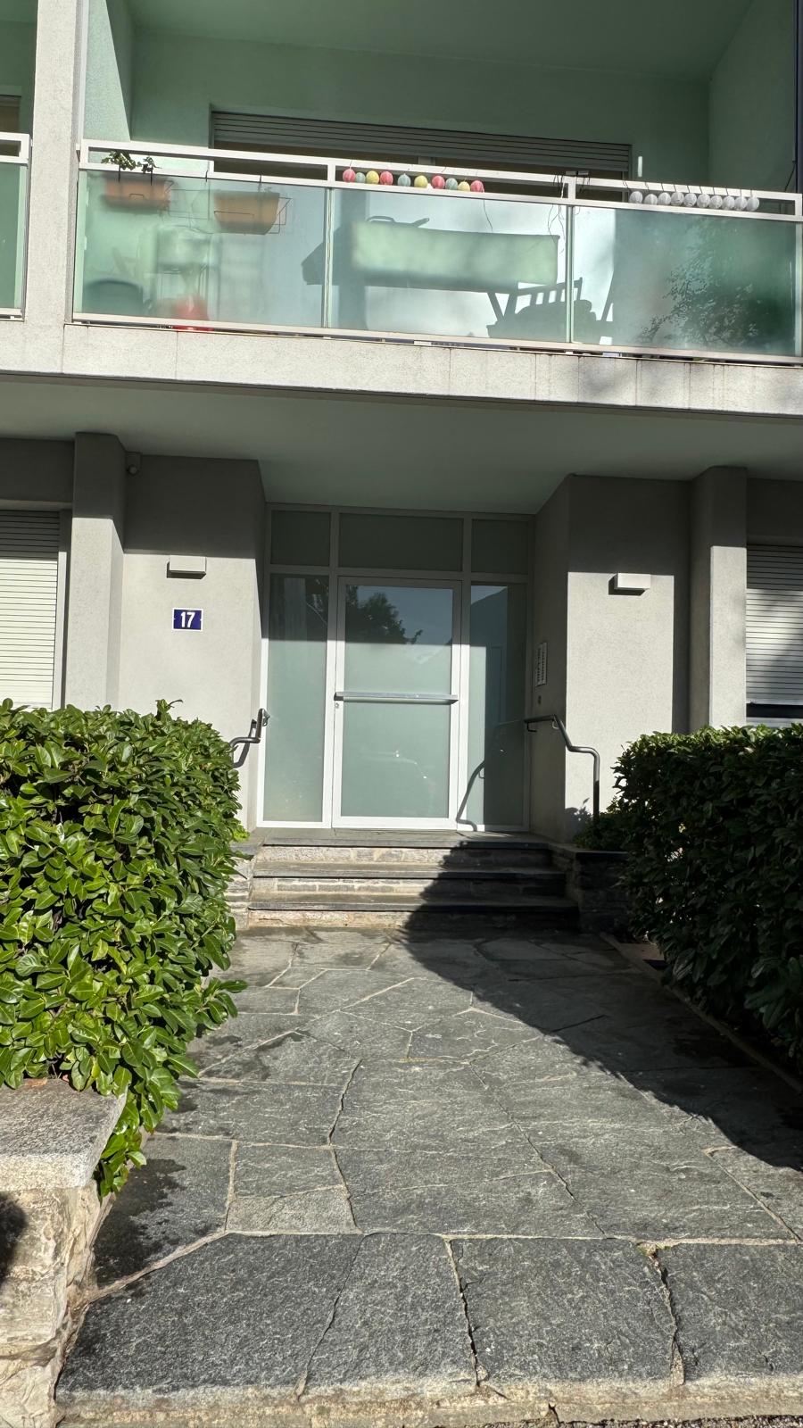Main entrance of Via del Tiglio 17 with the number 17 plaque