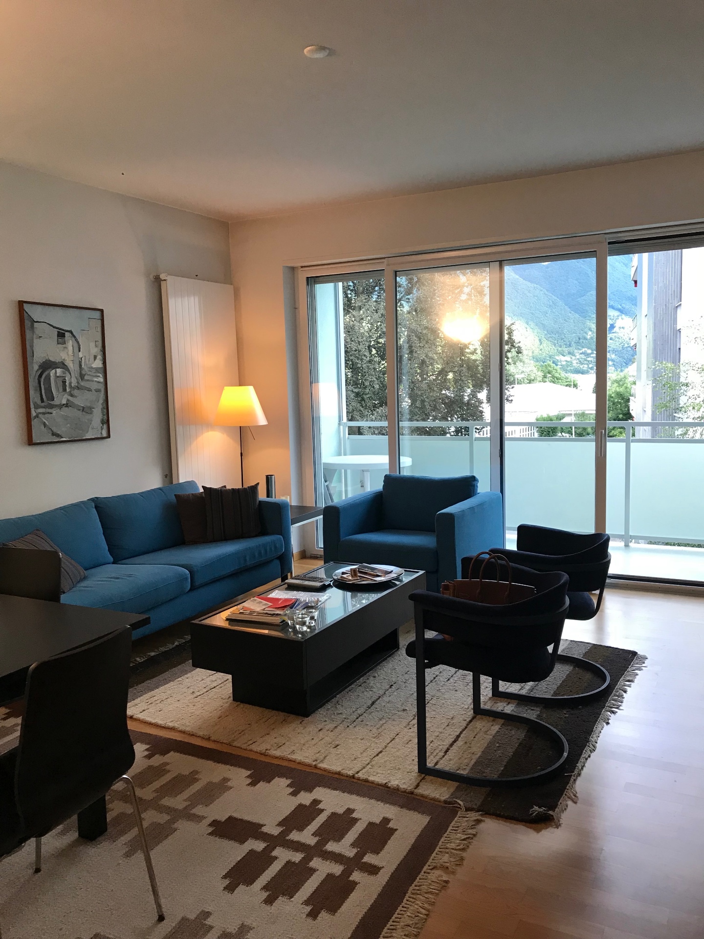 Furnished living room with mountain view and balcony at Via del Tiglio 17, Lugano